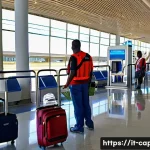 Home 17 카보베르데 가는 방법 - A vibrant airport scene at Amílcar Cabral International Airport in Sal, Cape Verde, showcasing passe...